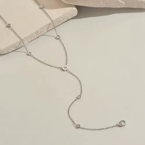 Silver lariat necklace with cubic zirconia.