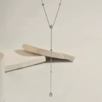 Silver-tone lariat necklace with cubic zirconia.