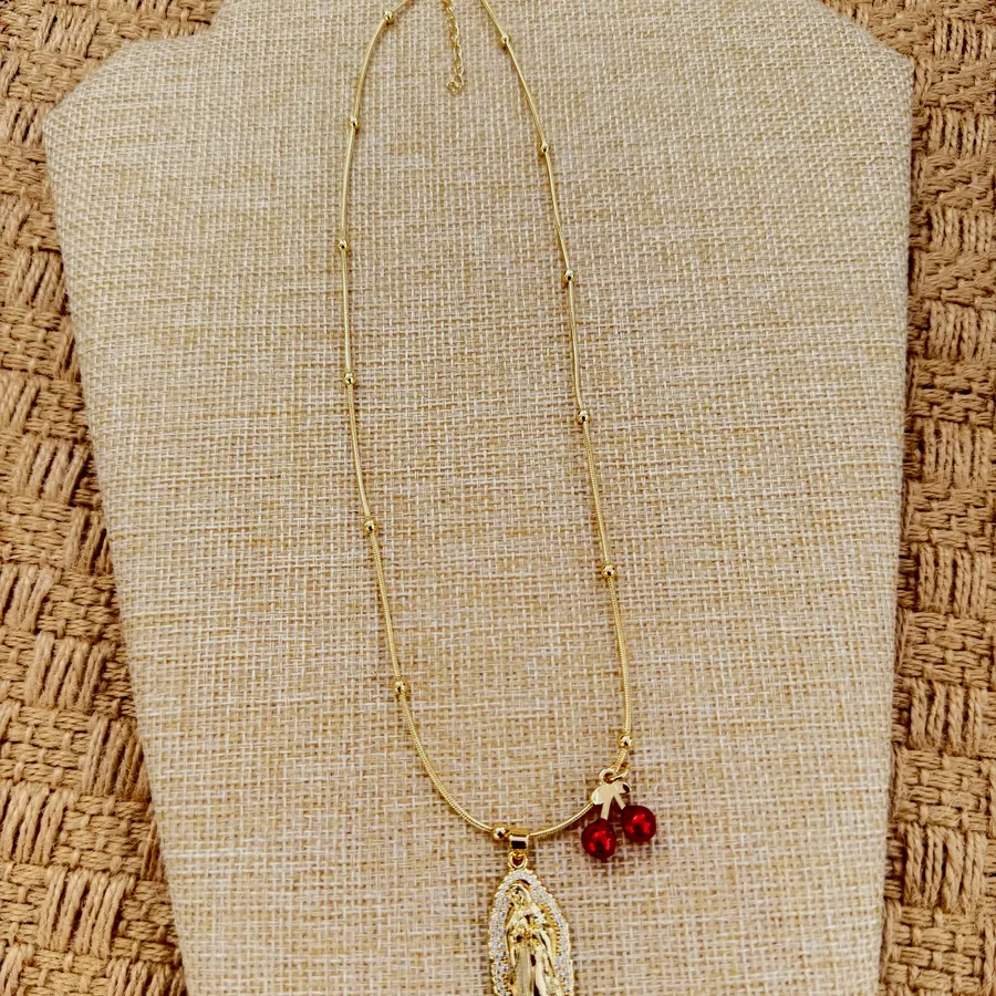Another view of the medal and garnet necklace.