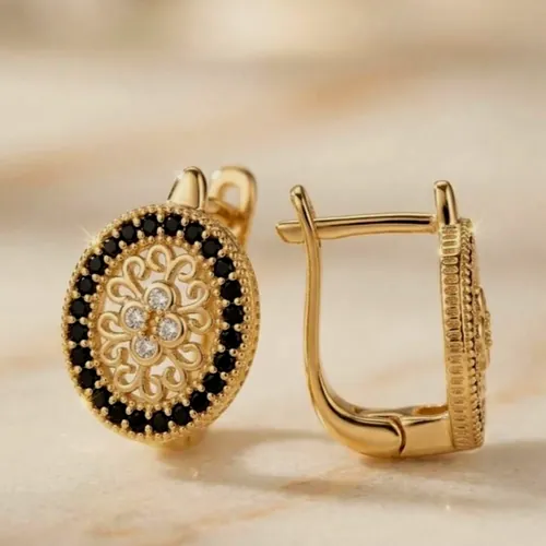 Oval hoops with a black dot mosaic.
