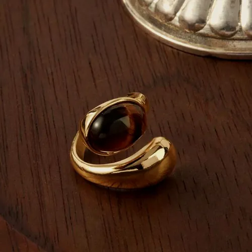 Dome ring with a tiger's eye sphere.